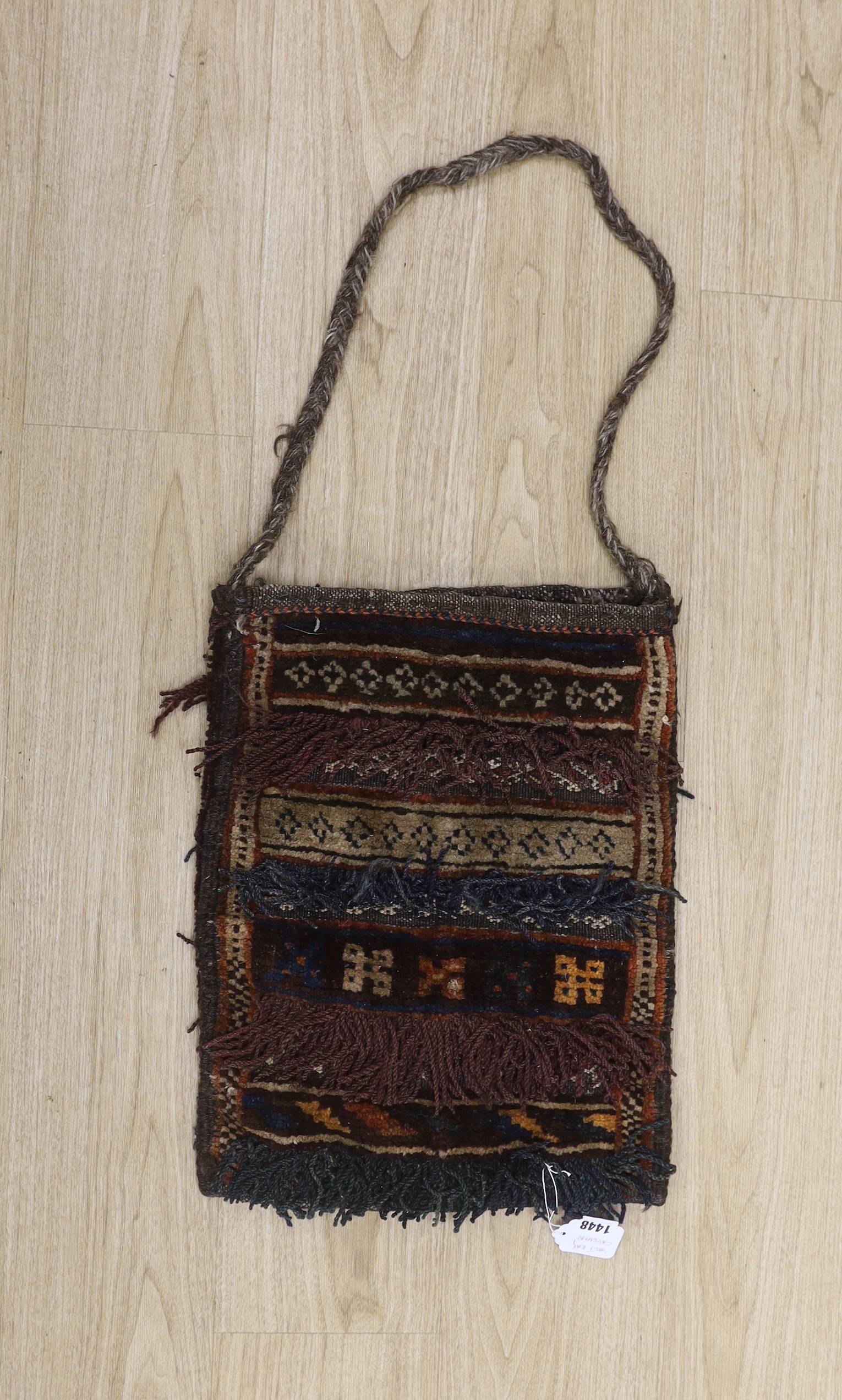 A Caucasian ‘salt’ carpet bag with tasseling, 38cm x 48cm